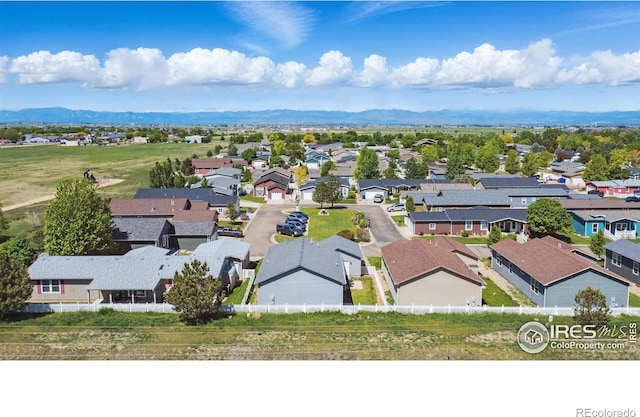 6150 Bluestem Grn, Frederick, CO 80530 - aerial view of residential area with a mountain backdrop