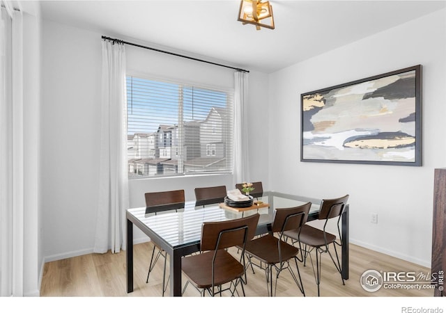 12155 W 57th Pl, Arvada, CO 80002 - dining room with wood finished floors and baseboards