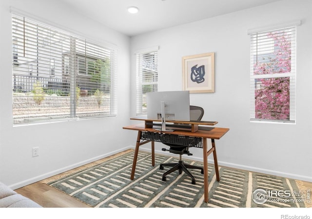 12155 W 57th Pl, Arvada, CO 80002 - office area featuring plenty of natural light and wood finished floors