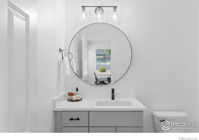 12155 W 57th Pl, Arvada, CO 80002 - bathroom featuring vanity and toilet