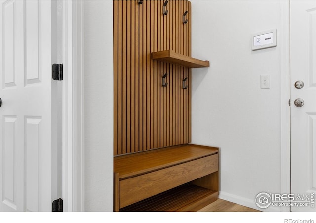 12155 W 57th Pl, Arvada, CO 80002 - mudroom featuring baseboards and wood finished floors