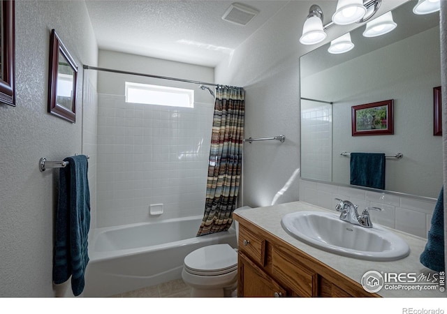631 Linecamp Dr, Livermore, CO 80536 - full bath with shower / bath combo with shower curtain, vanity, toilet, a textured wall, and decorative backsplash