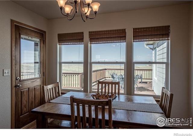 631 Linecamp Dr, Livermore, CO 80536 - dining area featuring a chandelier and plenty of natural light