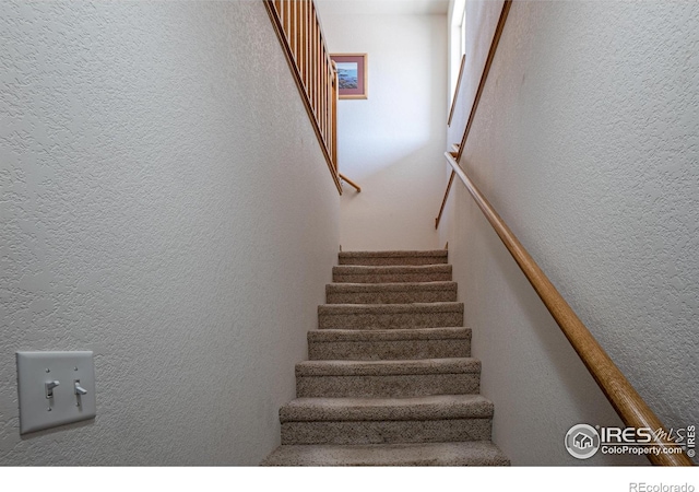 631 Linecamp Dr, Livermore, CO 80536 - stairway featuring a textured wall