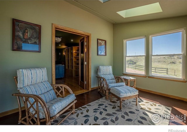 631 Linecamp Dr, Livermore, CO 80536 - sitting room featuring a skylight and baseboards