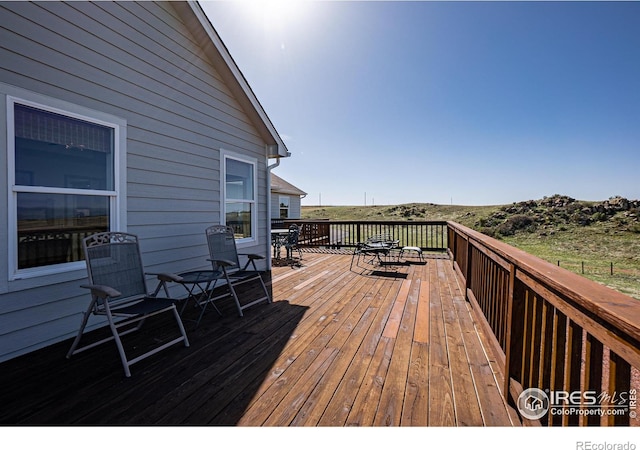 631 Linecamp Dr, Livermore, CO 80536 - wooden deck featuring outdoor dining space