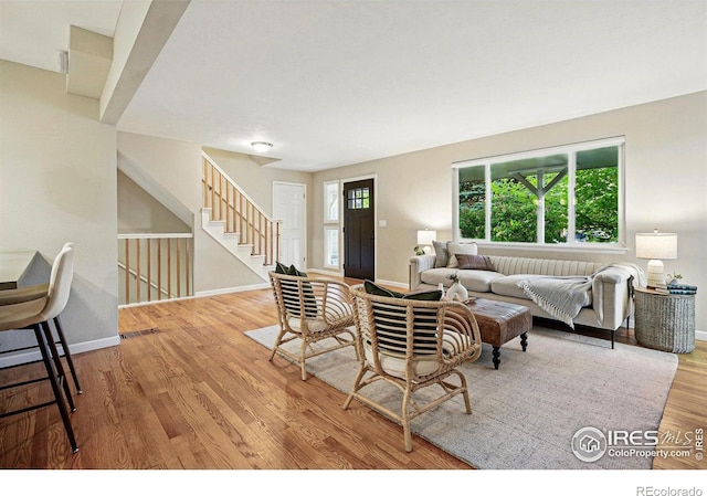 1359 Caledonia Cir, Louisville, CO 80027 - living area with baseboards, wood finished floors, and stairs