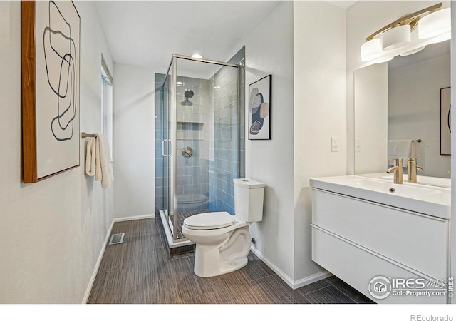 1359 Caledonia Cir, Louisville, CO 80027 - full bath featuring baseboards, toilet, vanity, a stall shower, and recessed lighting
