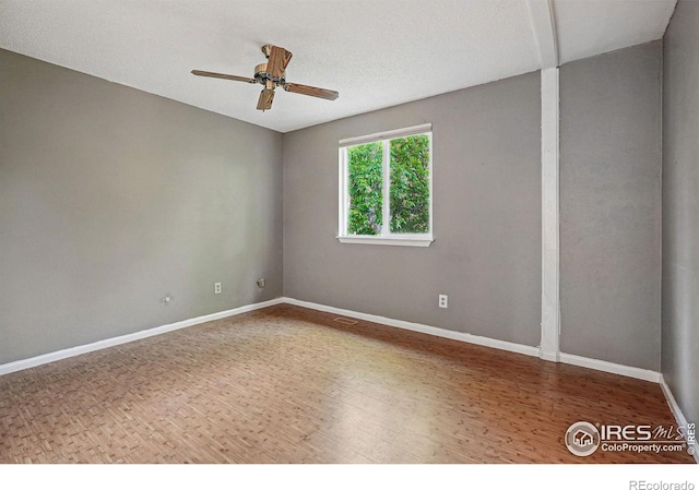1359 Caledonia Cir, Louisville, CO 80027 - empty room featuring wood finished floors, a ceiling fan, and baseboards