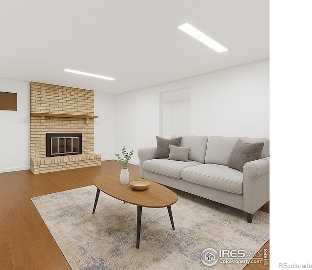 1359 Caledonia Cir, Louisville, CO 80027 - living room with wood finished floors, baseboards, and a brick fireplace