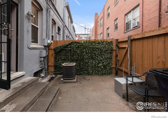 135 E 8th Ave, Denver, CO 80203 - view of patio / terrace featuring central air condition unit, a gate, and cooling unit