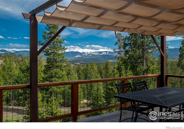 61 County Road 8501, Tabernash, CO 80478 - wooden deck with a mountain view, a pergola, and a forest view