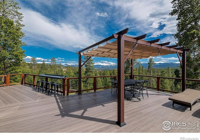 61 County Road 8501, Tabernash, CO 80478 - deck with outdoor dining space, a pergola, and a mountain view