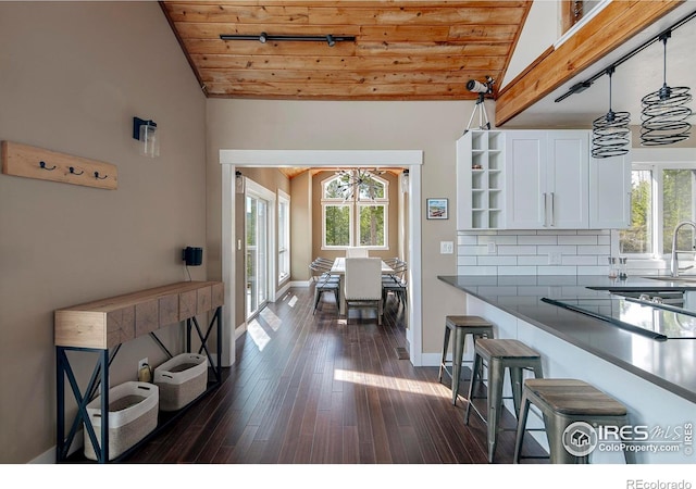 61 County Road 8501, Tabernash, CO 80478 - kitchen featuring lofted ceiling, wood ceiling, open shelves, plenty of natural light, and white cabinets
