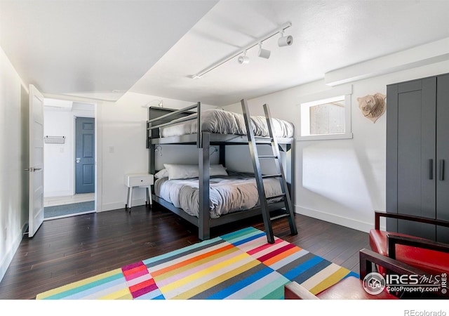 61 County Road 8501, Tabernash, CO 80478 - bedroom with wood finished floors, rail lighting, and baseboards