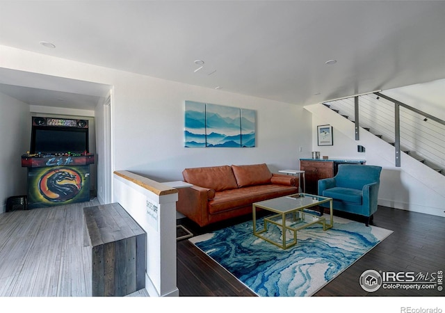 61 County Road 8501, Tabernash, CO 80478 - living room featuring wood finished floors, stairway, and baseboards