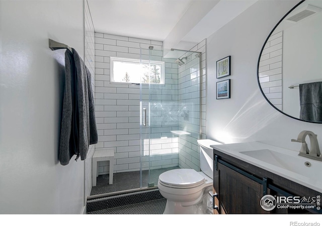 61 County Road 8501, Tabernash, CO 80478 - bathroom featuring vanity, toilet, and a stall shower