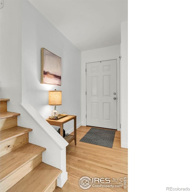 4658 Ingram Ct, Boulder, CO 80305 - entrance foyer featuring light wood-style flooring, stairs, and baseboards