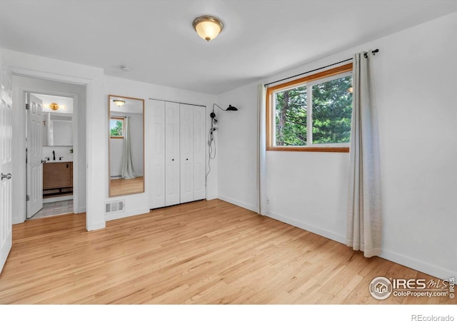 4658 Ingram Ct, Boulder, CO 80305 - unfurnished bedroom featuring light wood-style flooring, baseboards, a baseboard radiator, and a closet