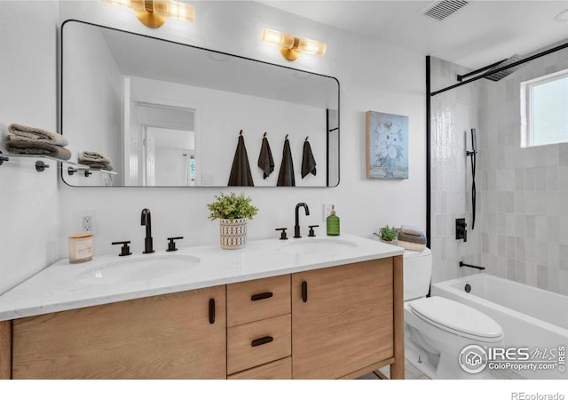 4658 Ingram Ct, Boulder, CO 80305 - bathroom featuring double vanity, toilet, and shower / washtub combination