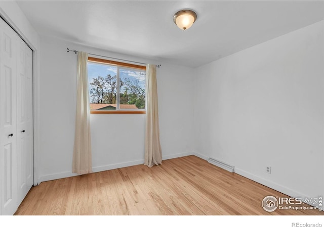 4658 Ingram Ct, Boulder, CO 80305 - unfurnished bedroom with light wood-style floors, baseboards, and a closet