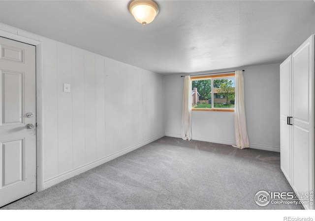 4658 Ingram Ct, Boulder, CO 80305 - spare room with carpet flooring, baseboards, and a textured ceiling
