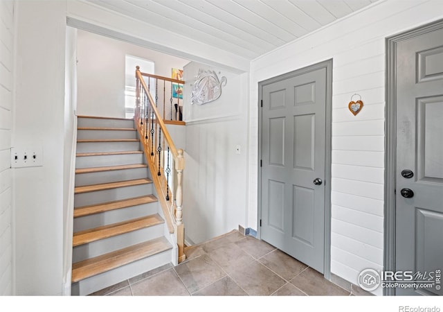 1921 Glenview Ct, Berthoud, CO 80513 - entryway featuring stairs, wooden ceiling, and tile patterned flooring