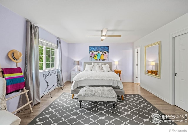 1921 Glenview Ct, Berthoud, CO 80513 - bedroom with wood finished floors, a ceiling fan, and baseboards