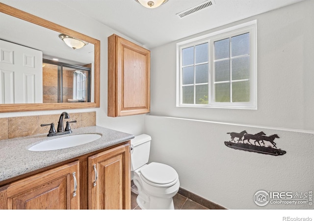 1921 Glenview Ct, Berthoud, CO 80513 - full bathroom featuring toilet, vanity, and an enclosed shower