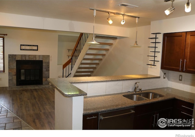 4775 White Rock Cir Unit B, Boulder, CO 80301 - kitchen with dishwasher, a sink, decorative backsplash, and dark stone counters