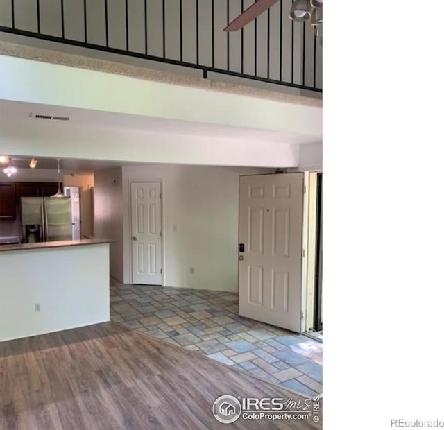 4775 White Rock Cir Unit B, Boulder, CO 80301 - foyer entrance featuring a towering ceiling and stone finish floors