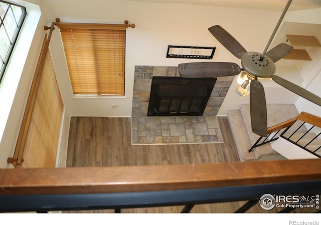 4775 White Rock Cir Unit B, Boulder, CO 80301 - detailed view of a tile fireplace, ceiling fan, and wood finished floors