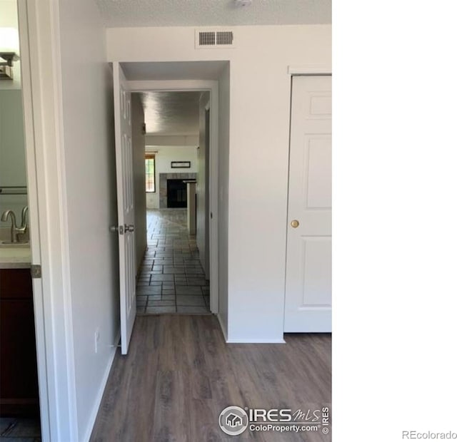 4775 White Rock Cir Unit B, Boulder, CO 80301 - hallway with a sink, dark wood-type flooring, and baseboards