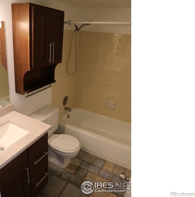 4775 White Rock Cir Unit B, Boulder, CO 80301 - bathroom with vanity, washtub / shower combination, toilet, and stone finish floors