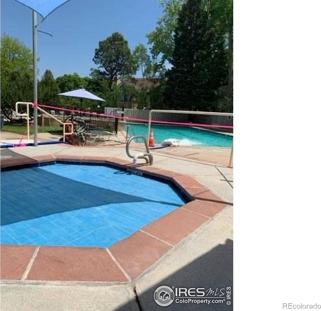 4775 White Rock Cir Unit B, Boulder, CO 80301 - view of swimming pool with a patio