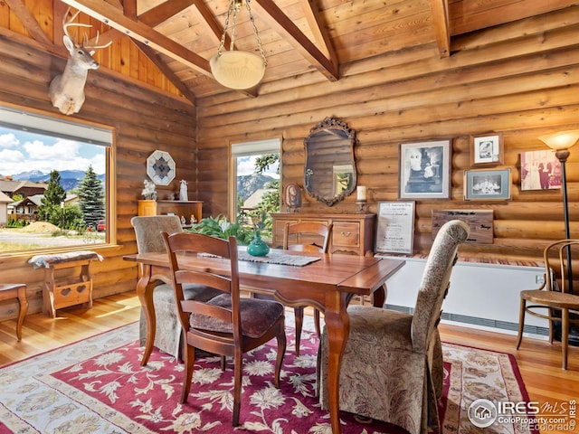 656 Halbach Ln, Estes Park, CO 80517 - dining room featuring wood ceiling, rustic walls, and wood finished floors
