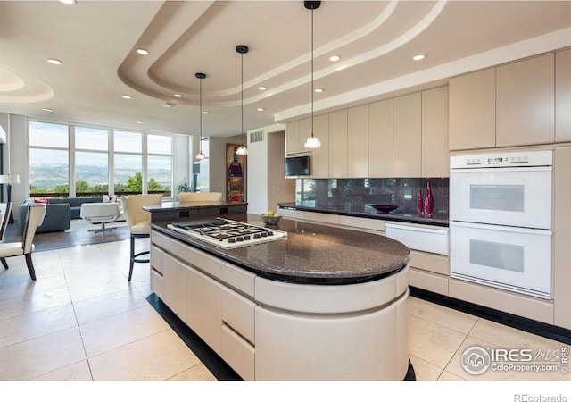 160 Ponderosa Dr, Boulder, CO 80303 - kitchen with white appliances, light tile patterned floors, recessed lighting, a warming drawer, and a raised ceiling