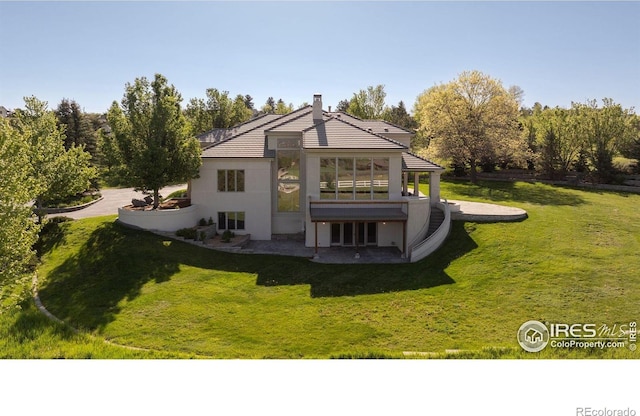 160 Ponderosa Dr, Boulder, CO 80303 - rear view of property with a patio area, a lawn, a chimney, and stucco siding