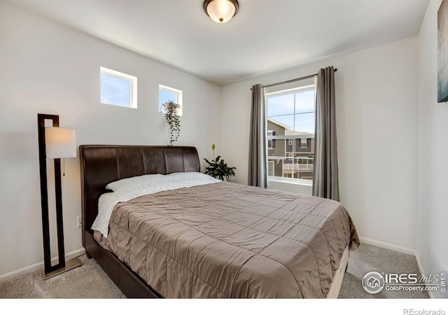 542 Highlands Cir, Erie, CO 80516 - bedroom with light carpet