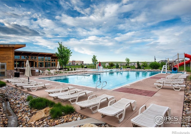 542 Highlands Cir, Erie, CO 80516 - community pool featuring a patio area and a water slide