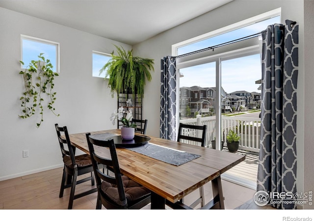 542 Highlands Cir, Erie, CO 80516 - dining area with wood finished floors and a residential view