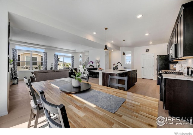 542 Highlands Cir, Erie, CO 80516 - dining space with light wood-style flooring and recessed lighting