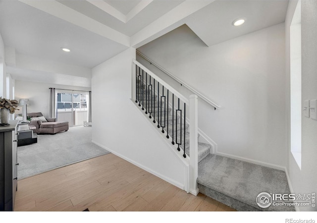 542 Highlands Cir, Erie, CO 80516 - staircase featuring wood finished floors, recessed lighting, and carpet flooring