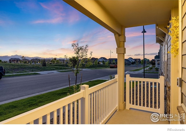 542 Highlands Cir, Erie, CO 80516 - balcony at dusk featuring a residential view