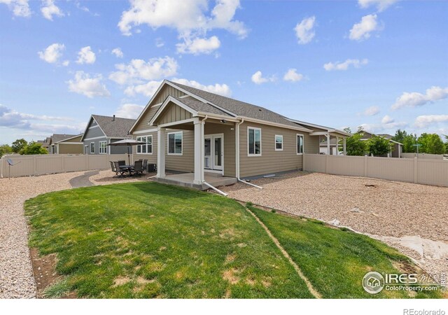 3802 Eucalyptus St, Wellington, CO 80549 - back of house featuring board and batten siding and a patio area