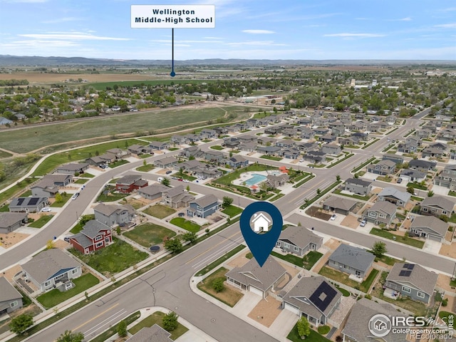 3802 Eucalyptus St, Wellington, CO 80549 - aerial view of residential area featuring mountains