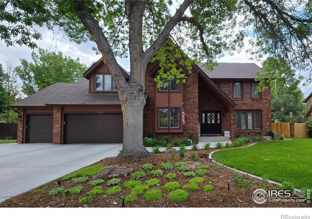2152 45th Ave, Greeley, CO 80634 - view of front facade featuring driveway, a shingled roof, and a garage