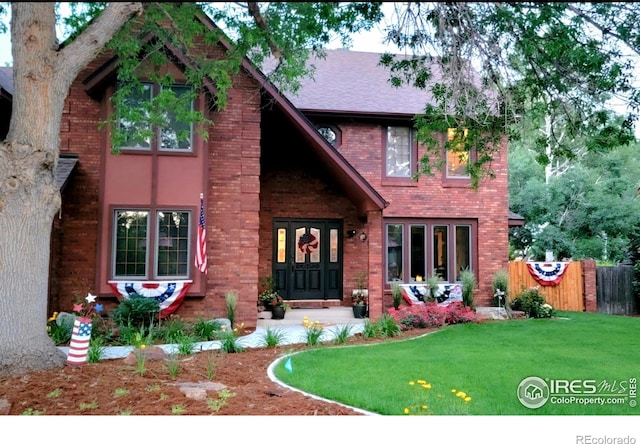 2152 45th Ave, Greeley, CO 80634 - view of front of home featuring brick siding and a shingled roof