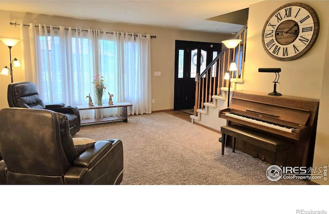 2152 45th Ave, Greeley, CO 80634 - living room with carpet flooring, stairway, and baseboards
