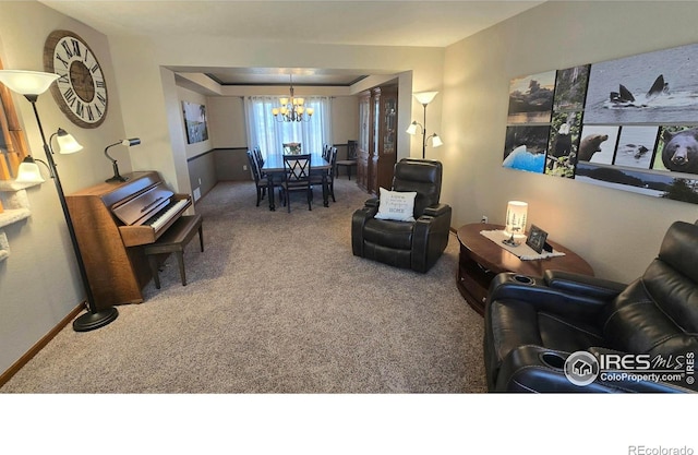 2152 45th Ave, Greeley, CO 80634 - carpeted living area featuring a chandelier and baseboards